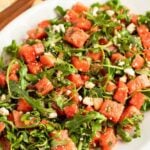 watermelon feta salad on white oval serving platter