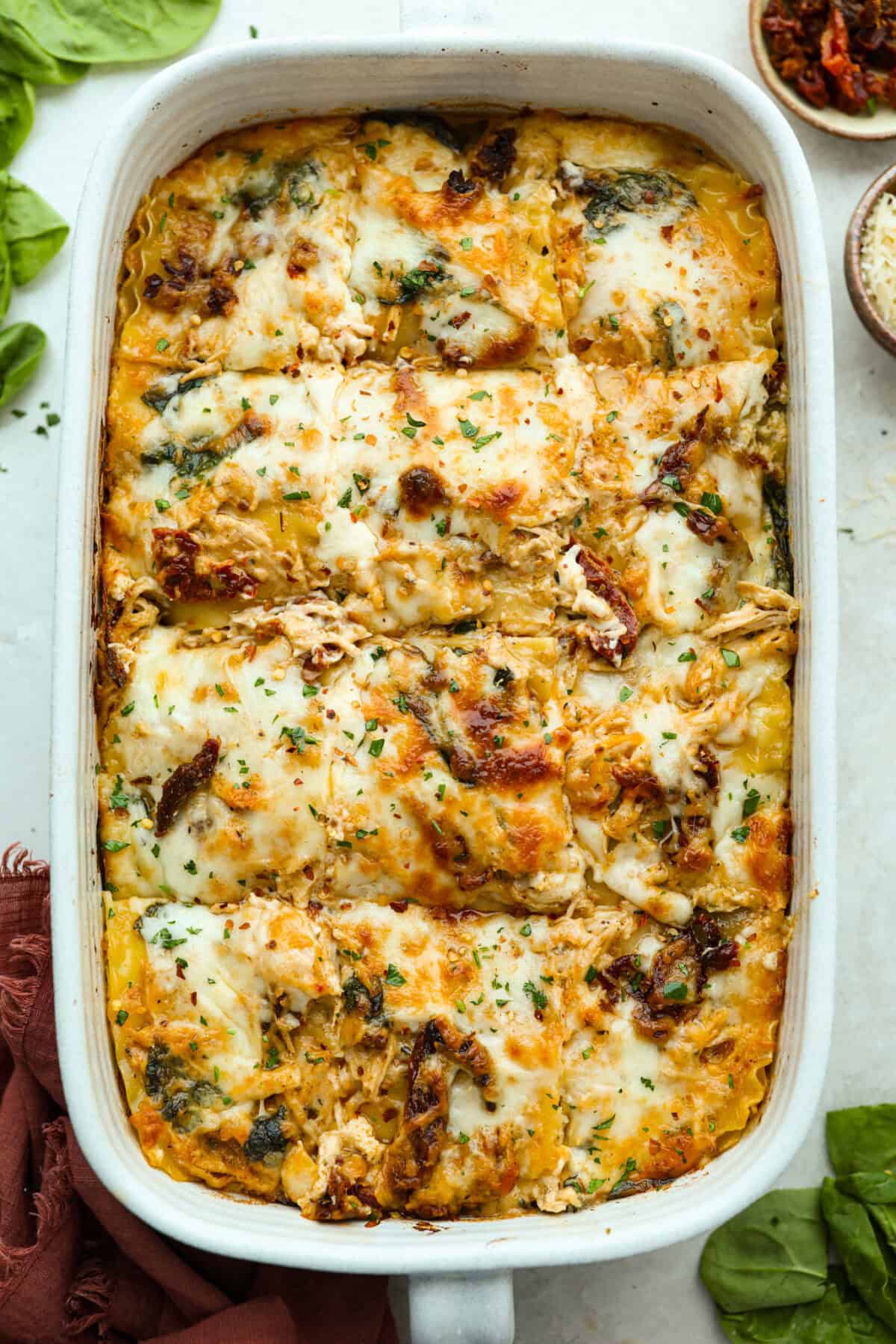They don’t call it Marry Me Lasagna for nothing! One bite of the creamy sauce, tender chicken, and melty cheese, and everyone will be saying, Overhead shot of marry me lasagna cooked and ready to be eaten.