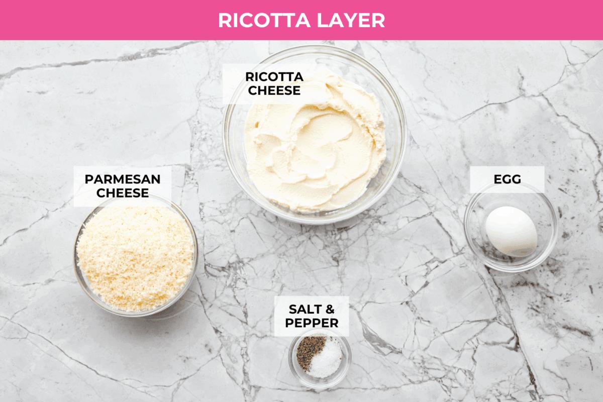 They don’t call it Marry Me Lasagna for nothing! One bite of the creamy sauce, tender chicken, and melty cheese, and everyone will be saying, Overhead shot of labeled ricotta layer ingredients.