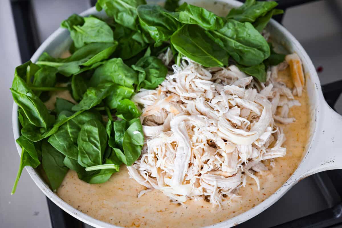 They don’t call it Marry Me Lasagna for nothing! One bite of the creamy sauce, tender chicken, and melty cheese, and everyone will be saying, Chicken and spinach added to the marry me lasagna sauce.
