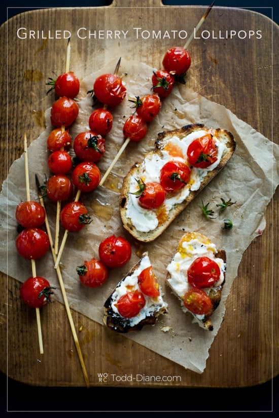 board of grilled cherry tomato lollipop skewers on creamy toast