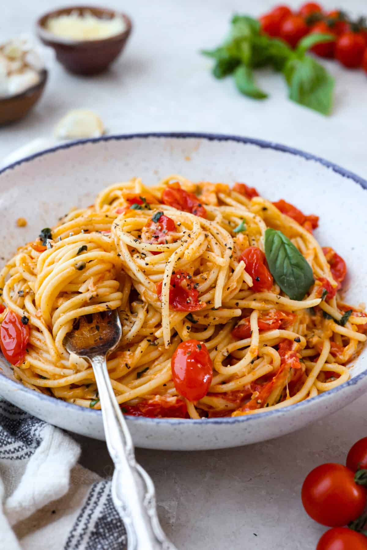 Plate of spaghetti margherita with a fork. 