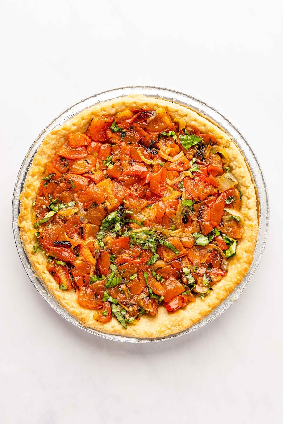 roasted tomato and onion mixture in crust
