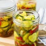 3 jars filled with bread and butter pickles