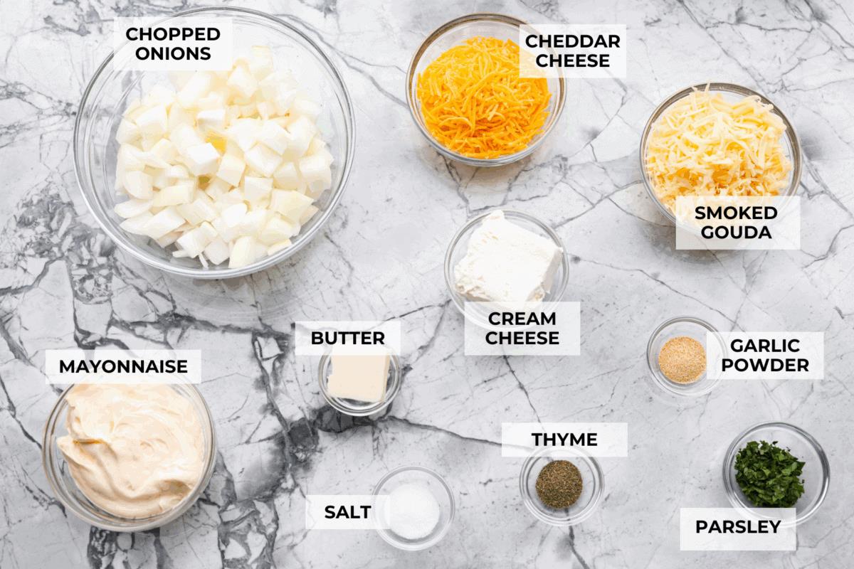 My Tennessee Onion Dip is a family-party legend. Everyone always begs me to bring it, and for good reason, the sweet onion flavor baked with gooey cheese and seasonings is absolutely irresistible! Overhead shot of labeled Tennessee onion dip ingredients.