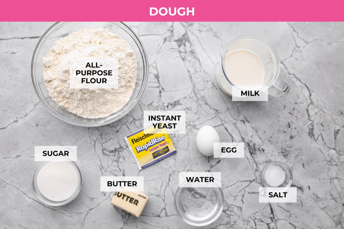 Overhead shot of labeled caramel apple cinnamon roll dough ingredients. 