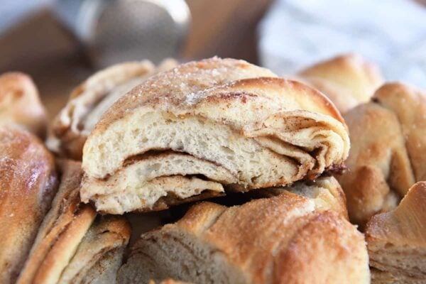 Piece of cinnamon sugar twisted croissant bread.