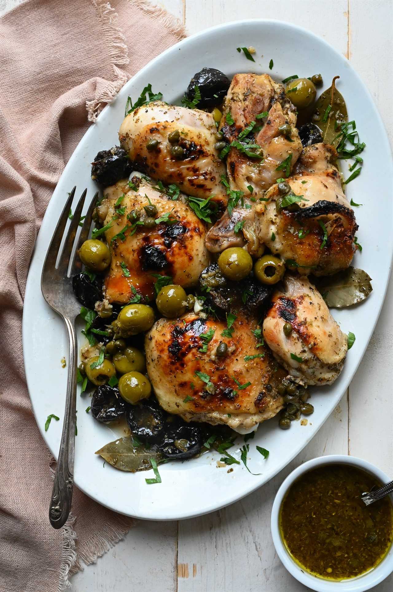 Chicken marbella on a platter.