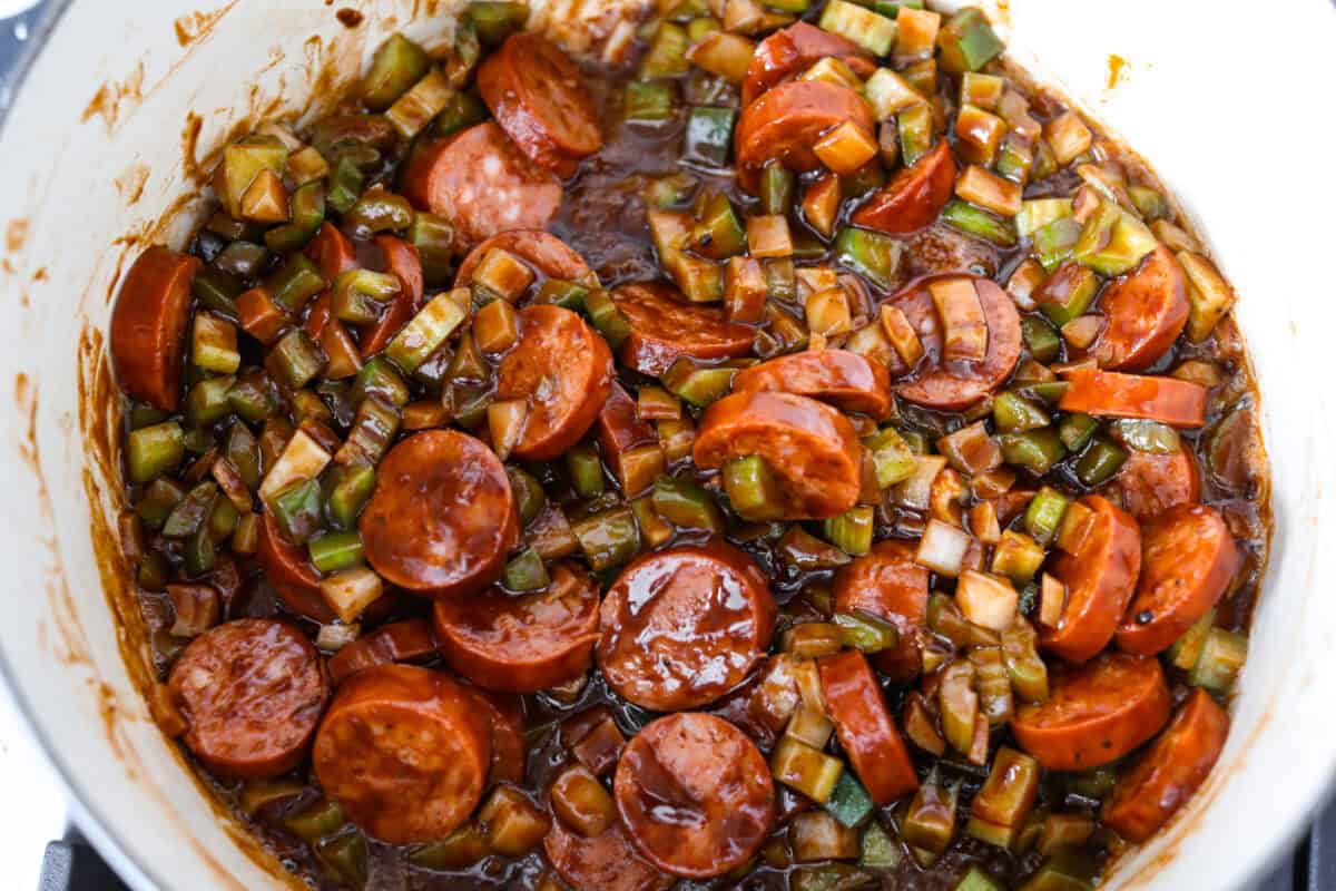 Sausage and veggies added to the pot of roux.