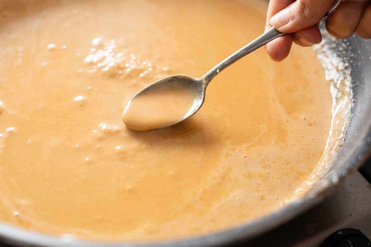 Ramen broth in a skillet.