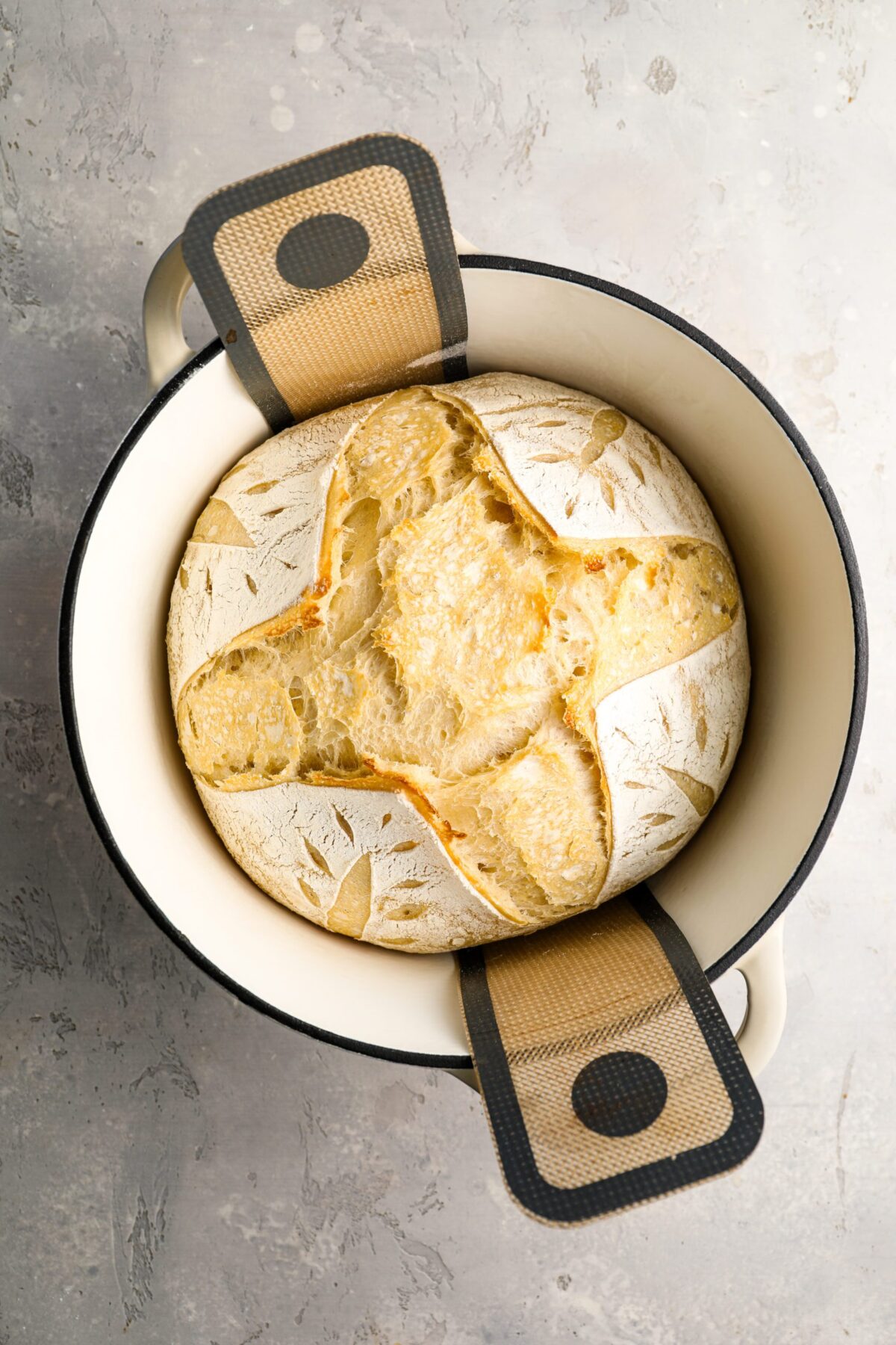 partially baked sourdough bread in Dutch oven