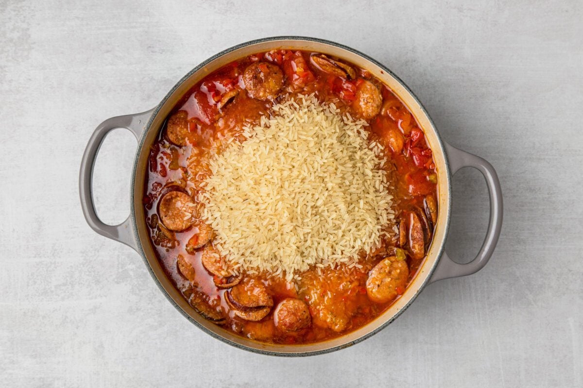 dutch oven with rice added to remaining ingredients