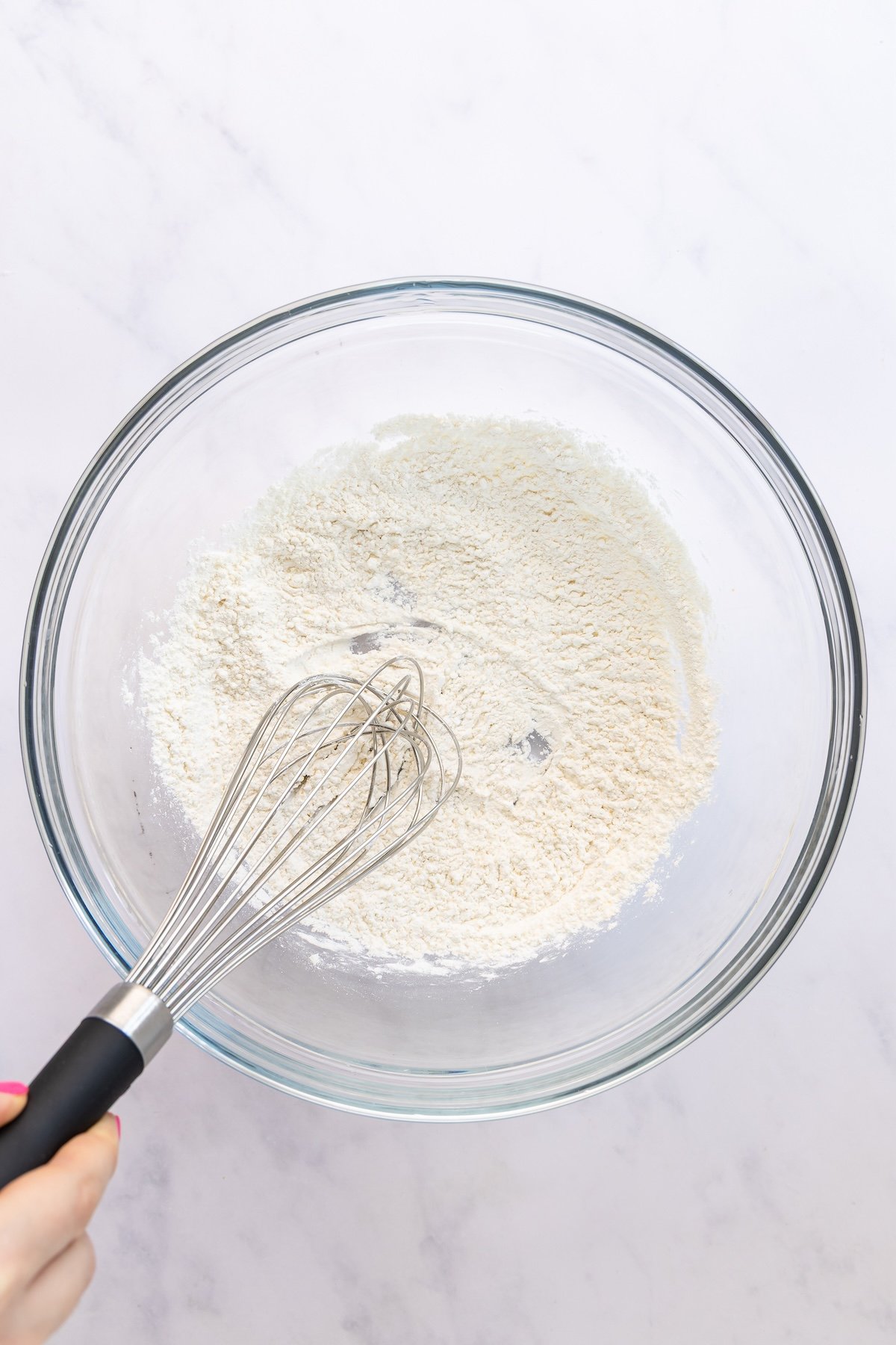 large bowl with cornstarch, flour, salt, garlic powder, and onion powder