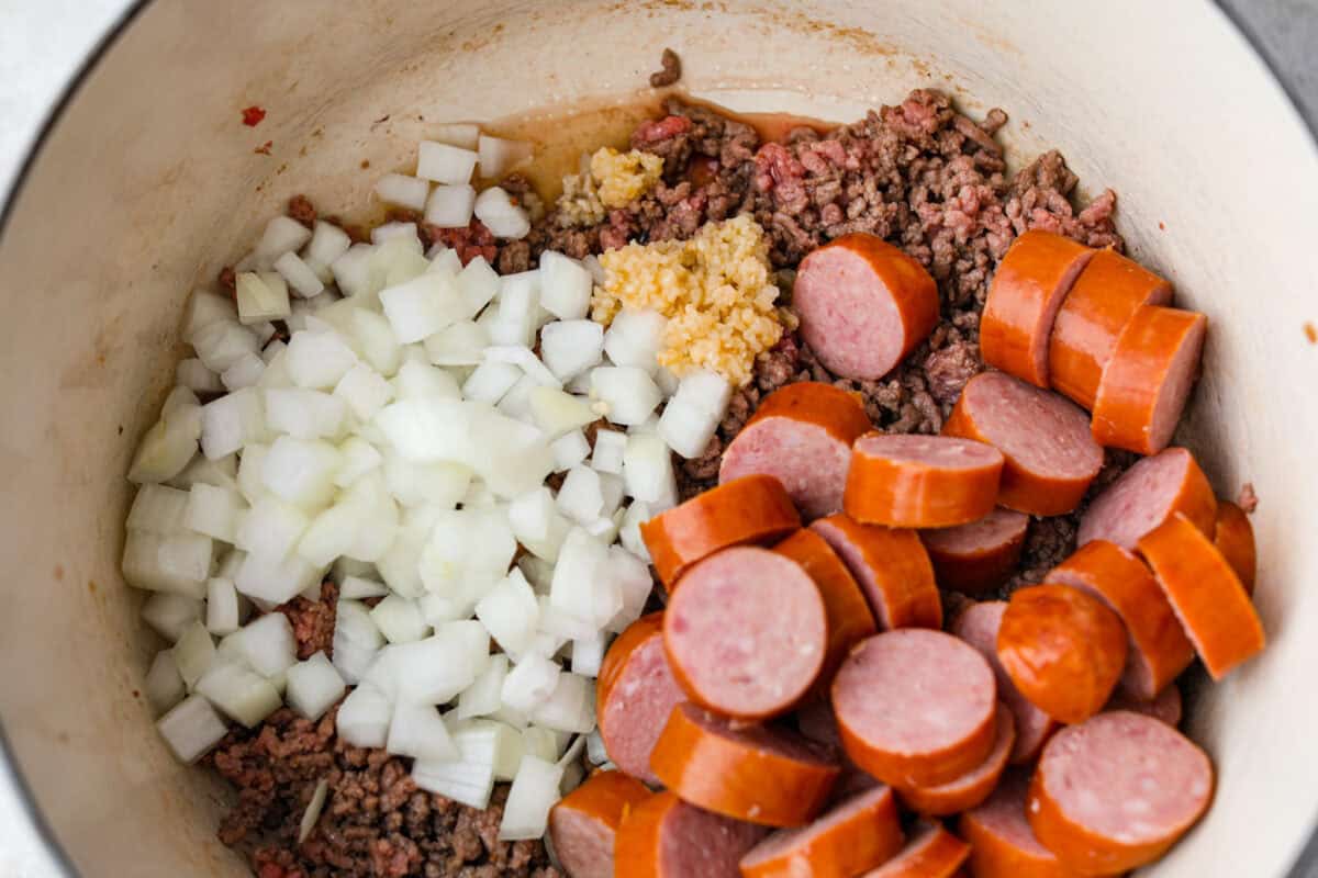 Sausage, onions, and garlic added to the cooked beef. 