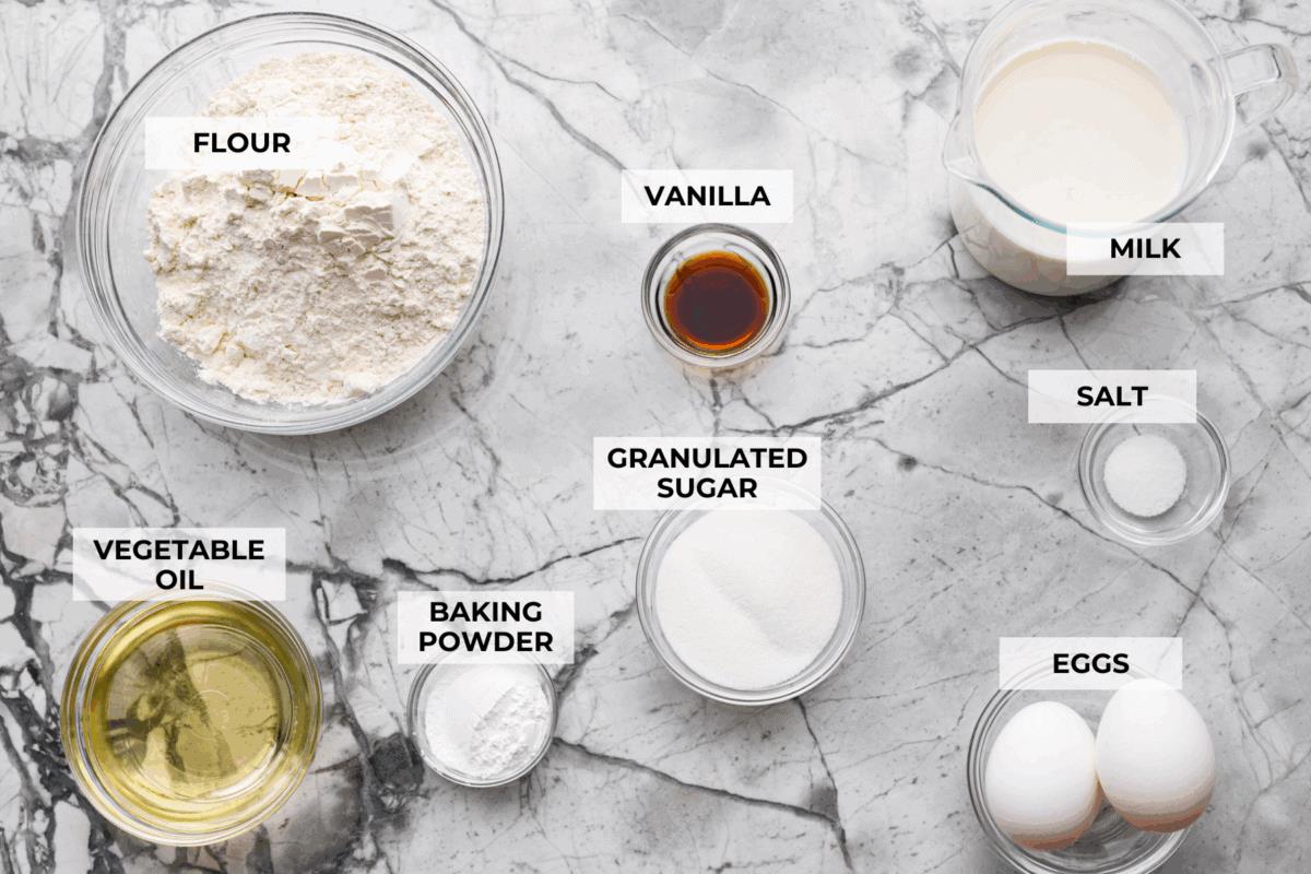 There’s nothing like my homemade Belgian waffles! They're crisp on the outside, soft and fluffy inside, with deep pockets for all the syrup and butter. The secret is whipping the egg whites for that light, airy texture! Overhead shot of labeled ingredients.