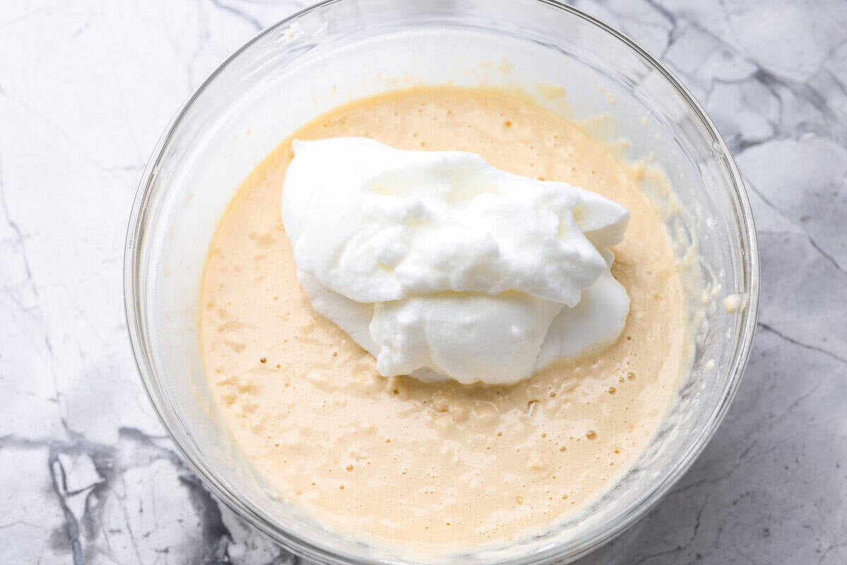 There’s nothing like my homemade Belgian waffles! They're crisp on the outside, soft and fluffy inside, with deep pockets for all the syrup and butter. The secret is whipping the egg whites for that light, airy texture! Whipped egg whites added to the Belgian waffle batter.