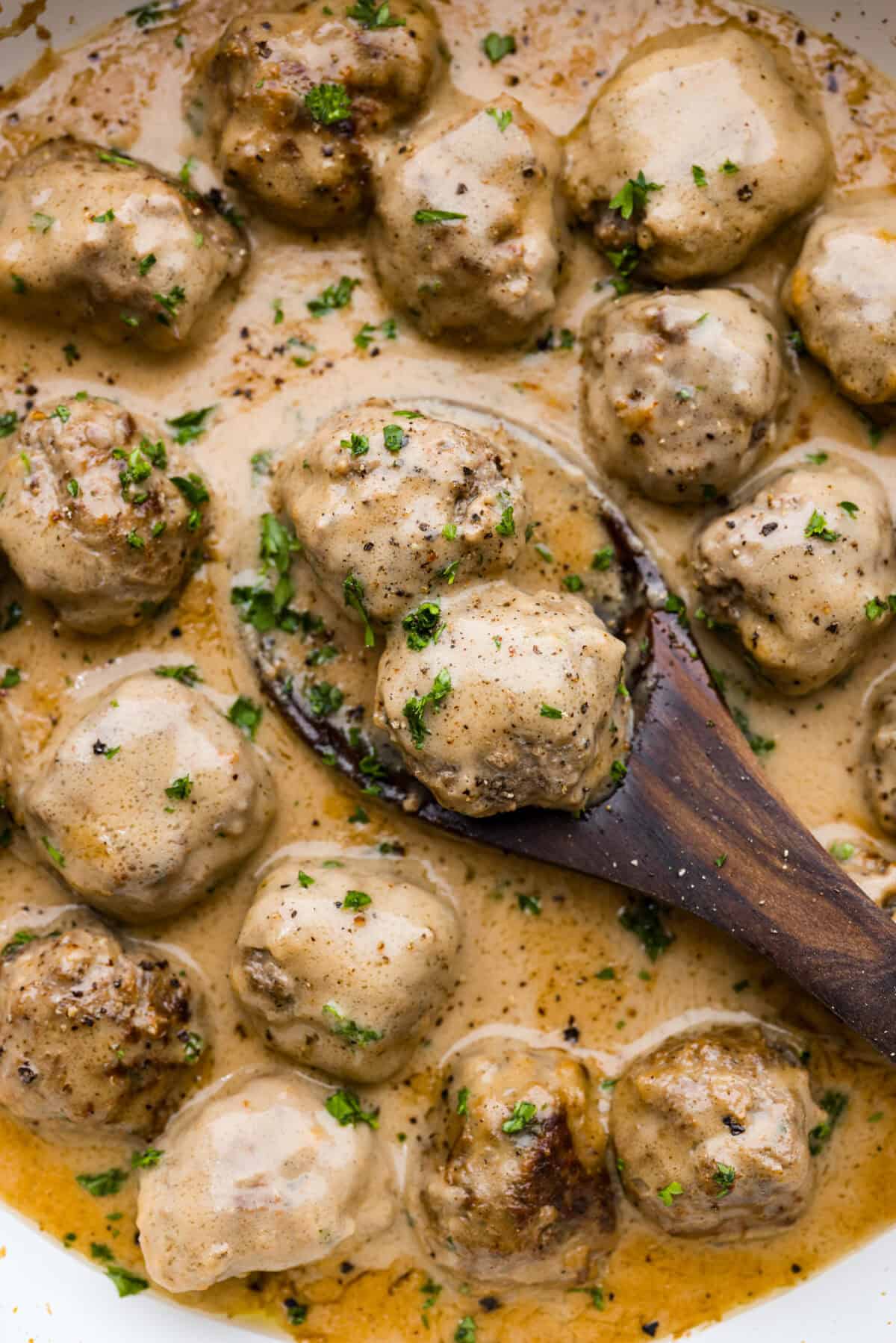 From frozen to from-scratch, this is your one-stop shop for all things Swedish Meatballs!  A close up of Swedish meatballs in sauce.
