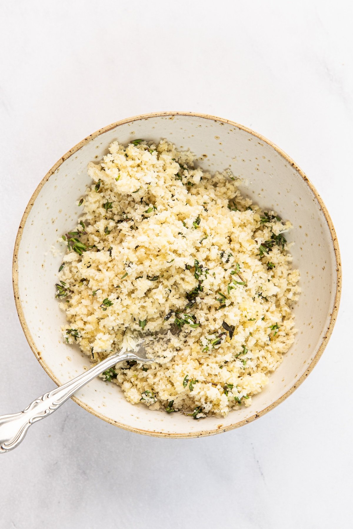 small bowl with panko, olive oil, remaining Pecorino Romano, thyme, salt and pepper combined for topping