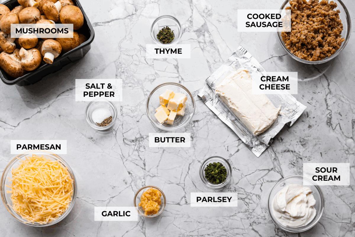 Overhead shot of labeled stuffed mushroom dip ingredients. 