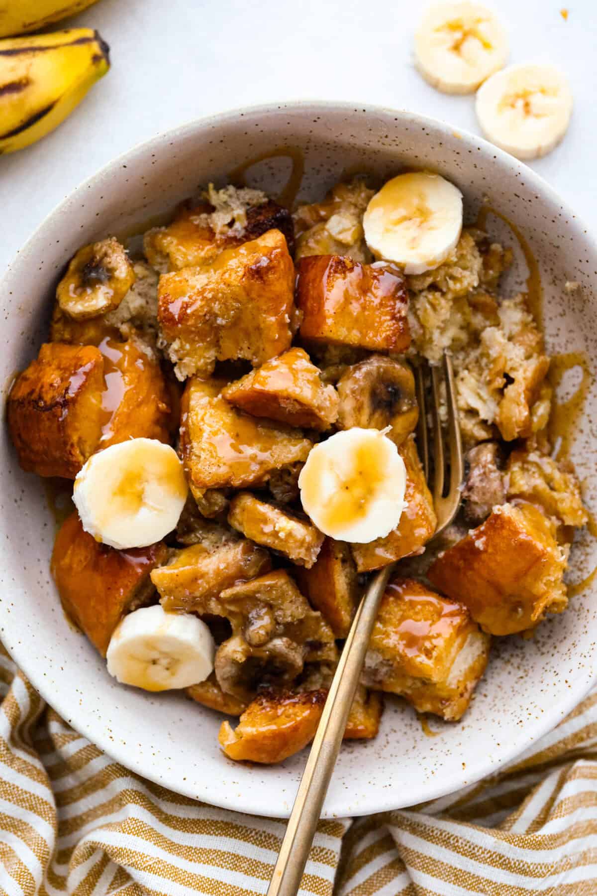 Bowl with a serving size of the banana bread pudding. 