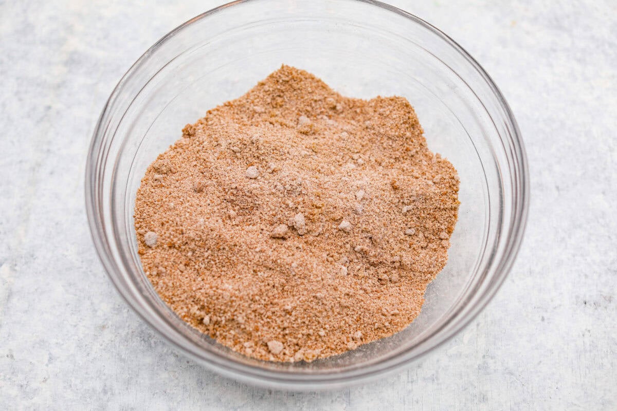Sugar and seasonings added to a bowl and mixed together. 