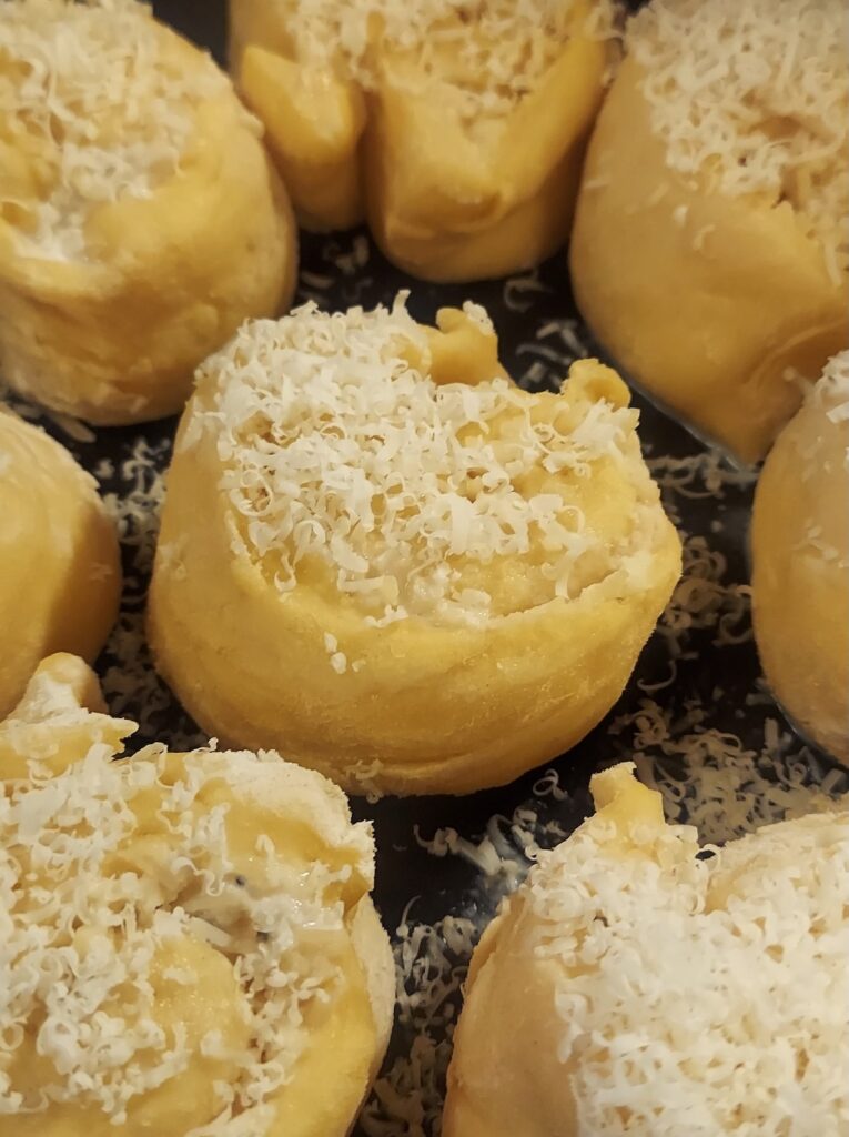 Cheesy cacio e pepe rolls, warm from the oven