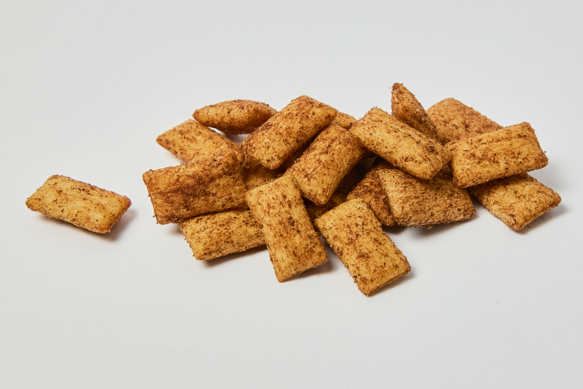 Pile of Cinnamon Crunch cereal. Sweet, crispy breakfast food.