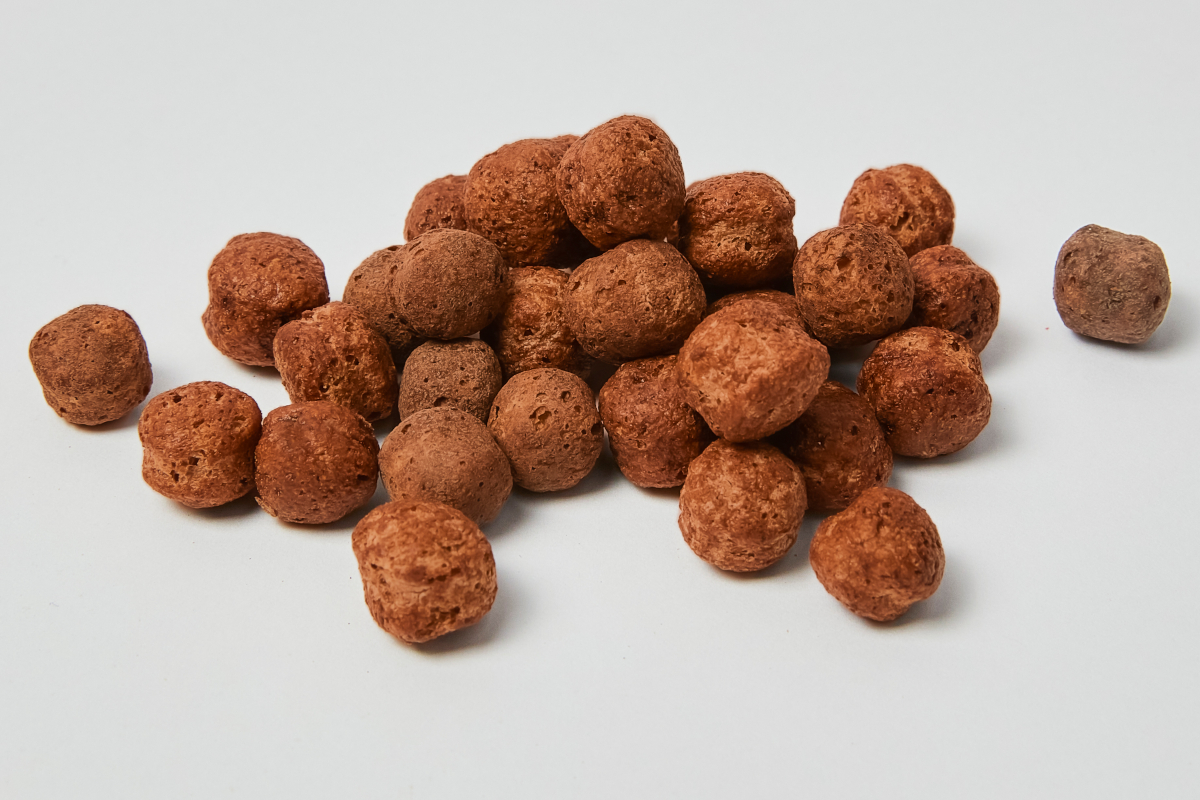 Molino Nicoli-Pile of chocolate balls. Delicious chocolate-covered cereal balls. Sweet snack.