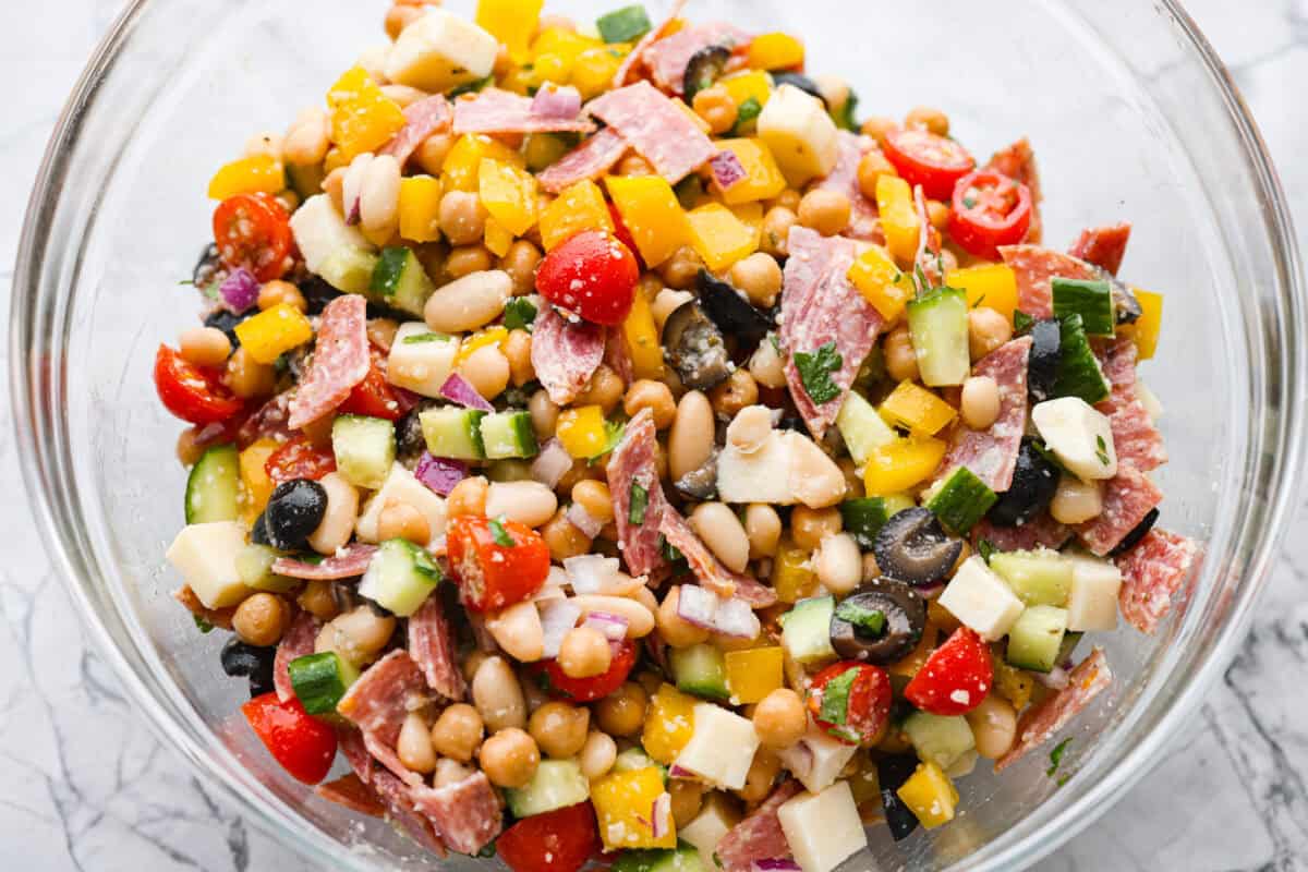 Large bowl of dense bean salad ingredients all mixed together.