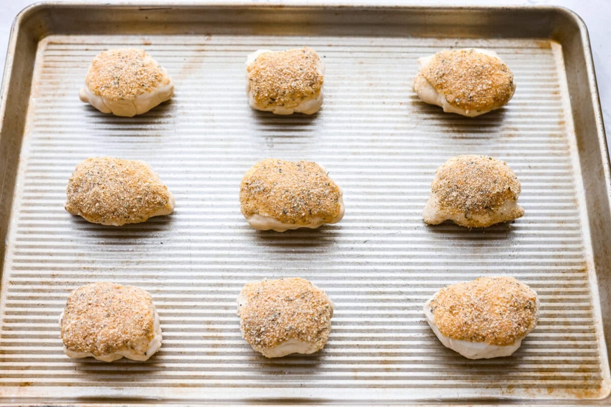 Chicken pillows on the baking sheet ready to go in the oven. 