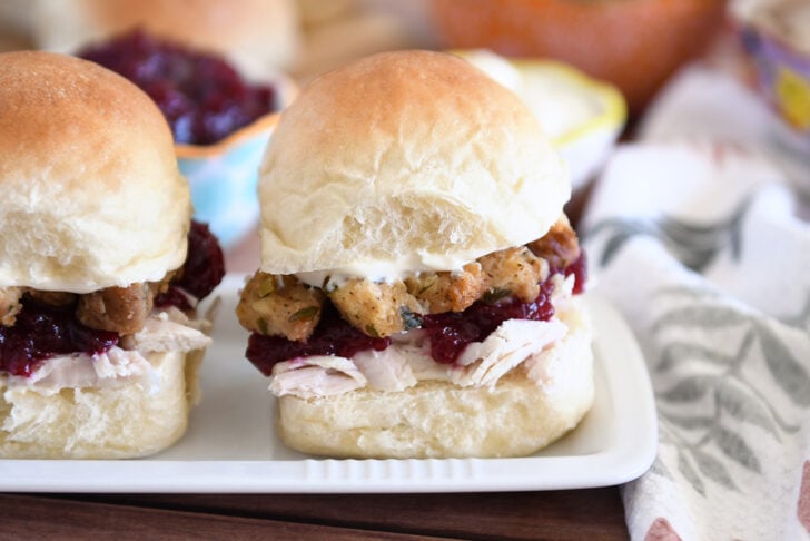 Homemade roll sandwiched with shredded turkey, cranberry sauce, stuffing and mayo.
