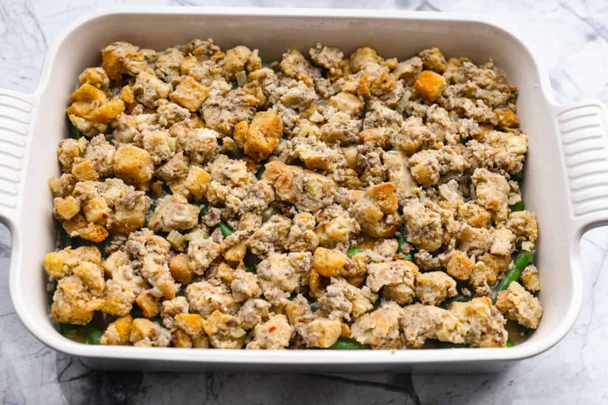 Stuffing added to the top of the gravy covered green beans. 