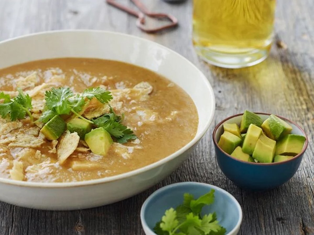 bowl of chicken tortilla soup with toppings