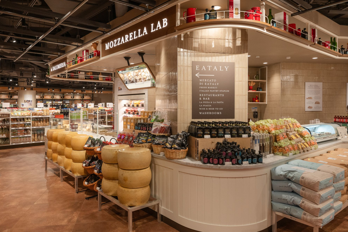 Eataly Eaton Centre Toronto: Mozzarella Lab, cheese wheels, Italian grocery market, fresh pasta, olive oil, and flour.