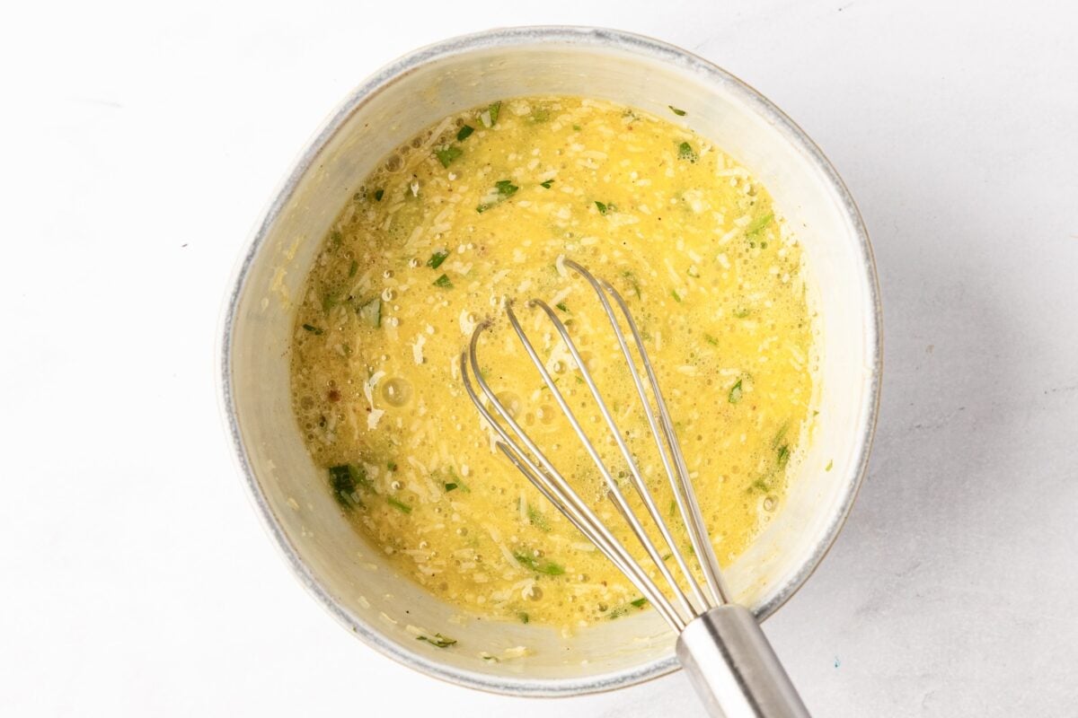 egg mixture for stracciatella soup whisked in bowl