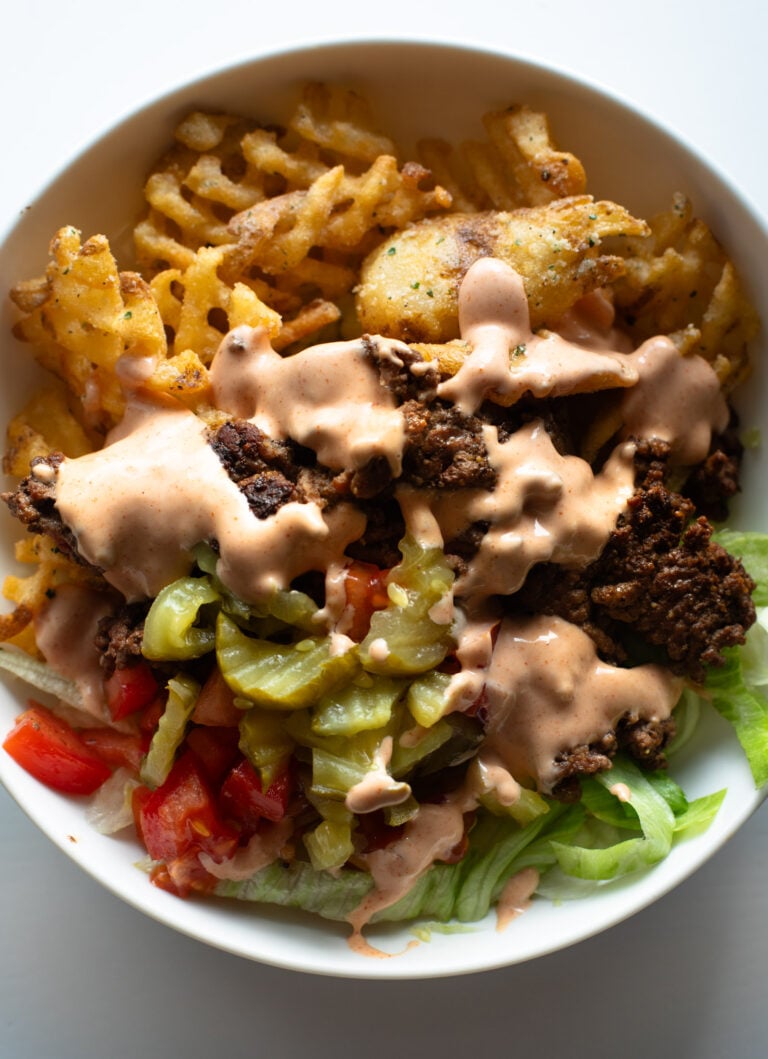 Burger bowl with fries.