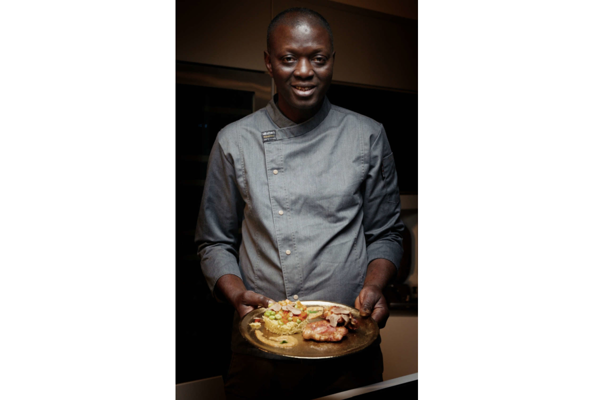 Chef Omar of Urbani Tartufi presents a gourmet dish. Fine dining, culinary arts.