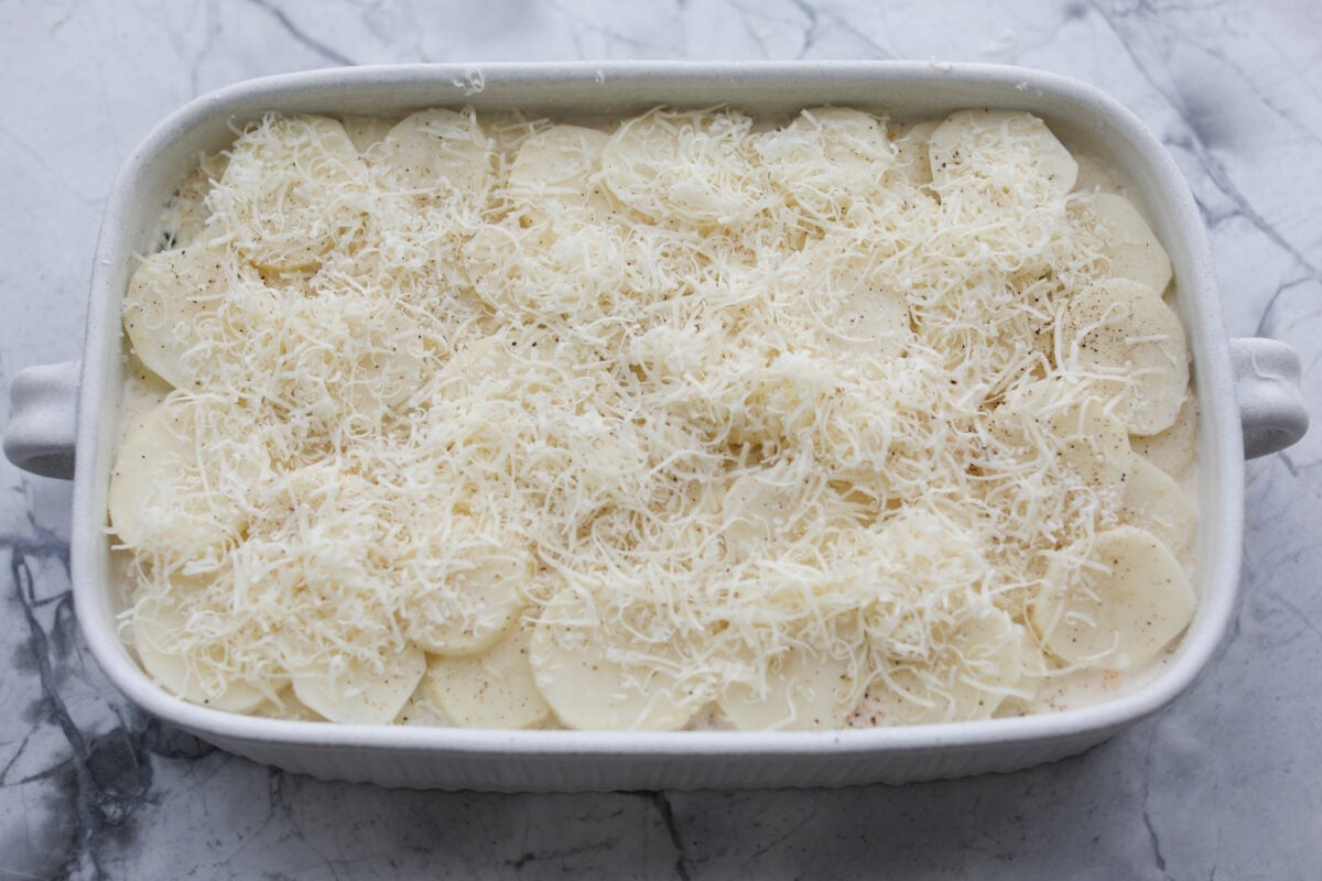 A layer of potatoes and cheese added to the top of the sauce mixture. 