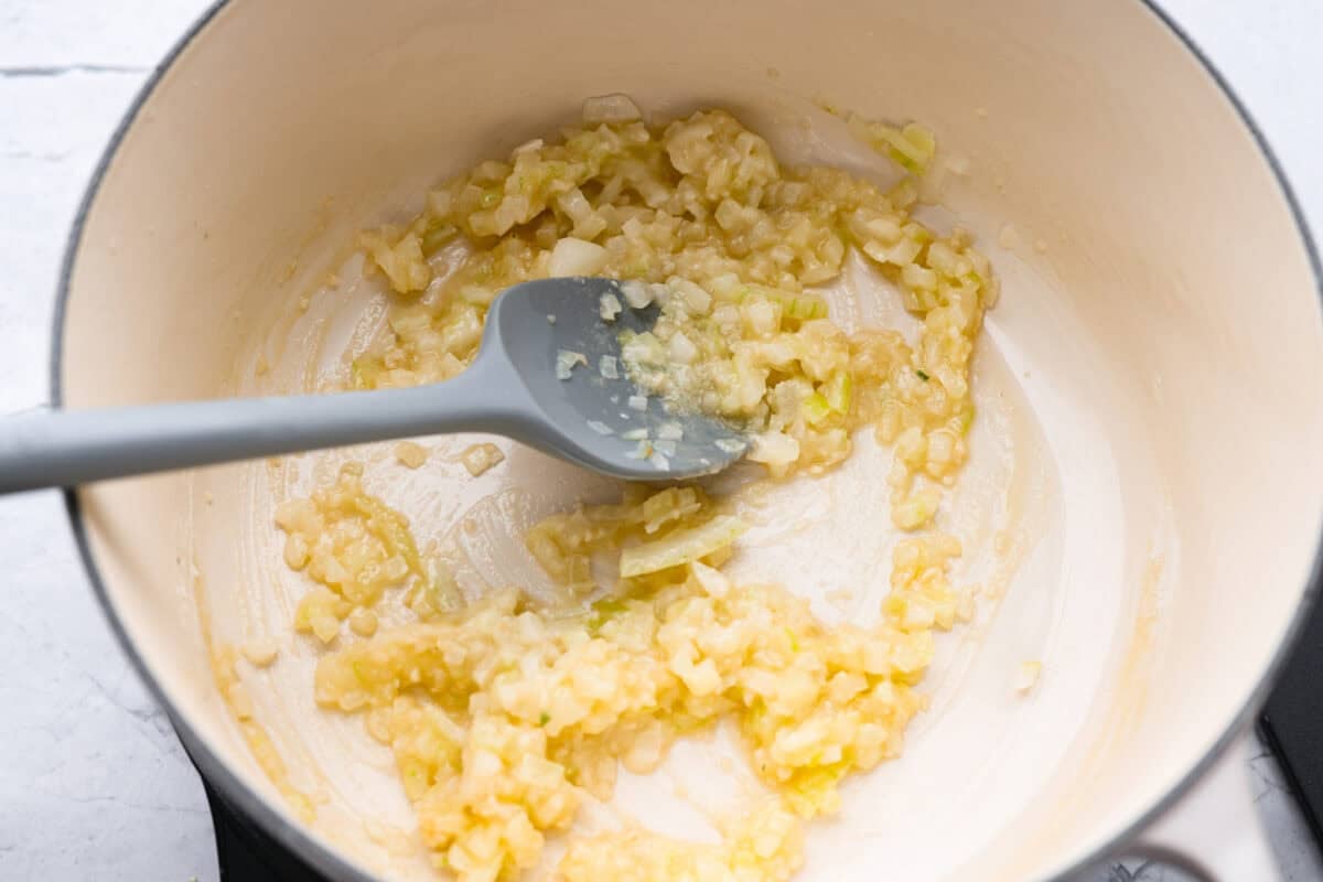 Butter, onion and garlic cooking in the bottom of the pot.