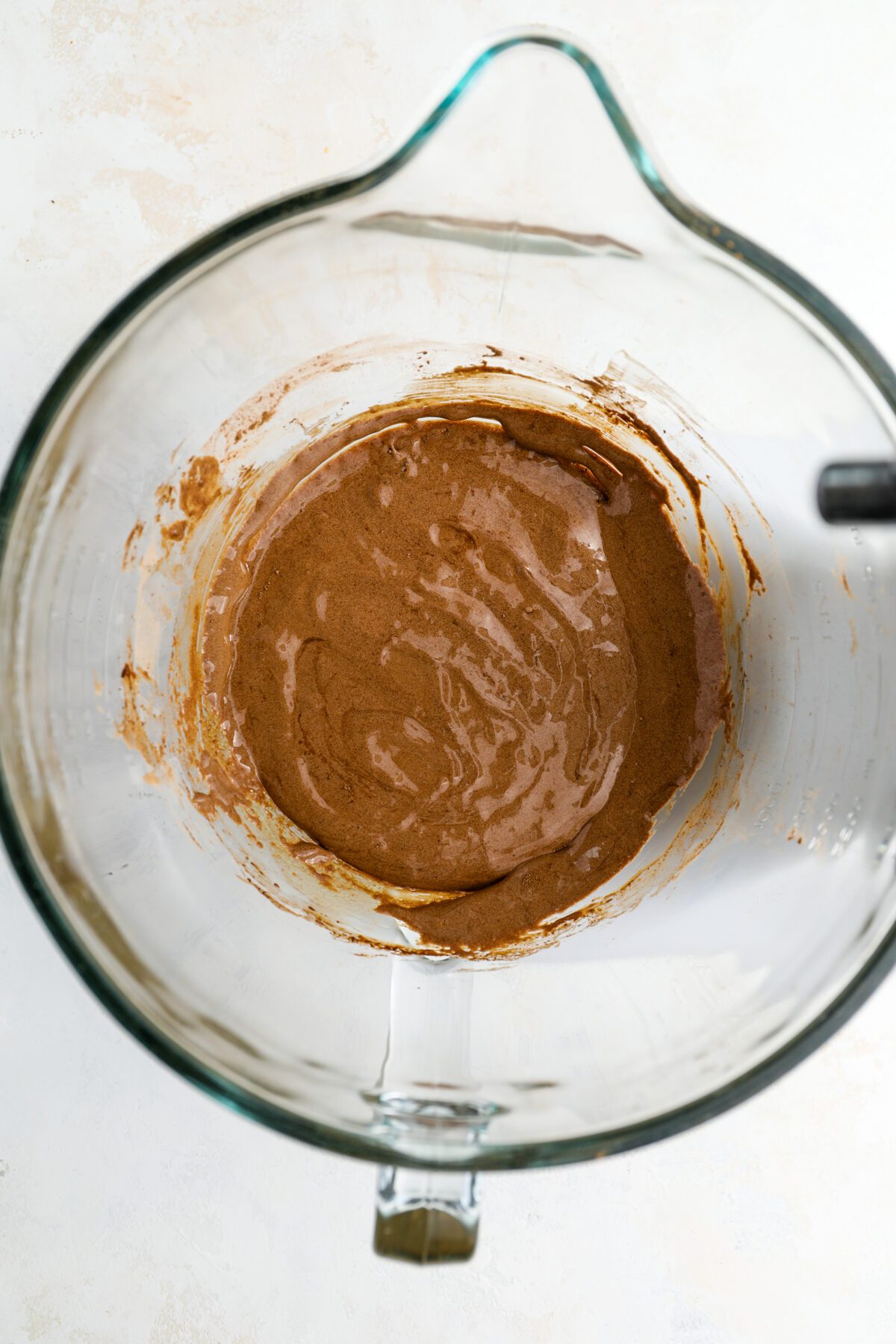 mixing bowl with cocoa powder, vanilla, and salt combined with egg yolk/sugar mixture