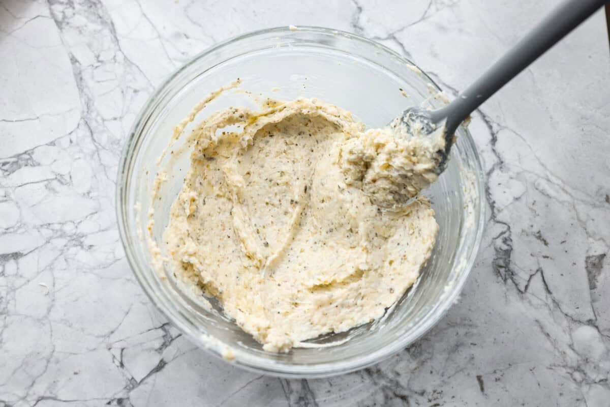Garlic butter mixture in a small glass bowl. 