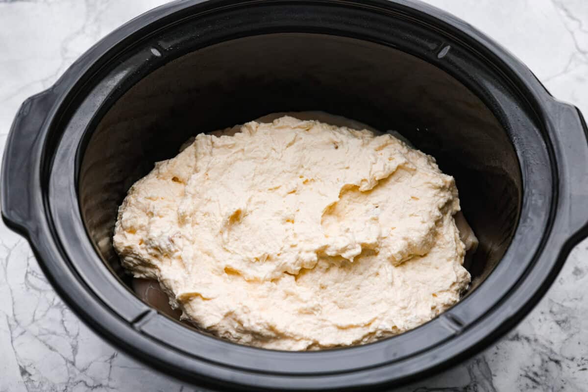 Soup and sour cream mixture added to the top of the chicken.