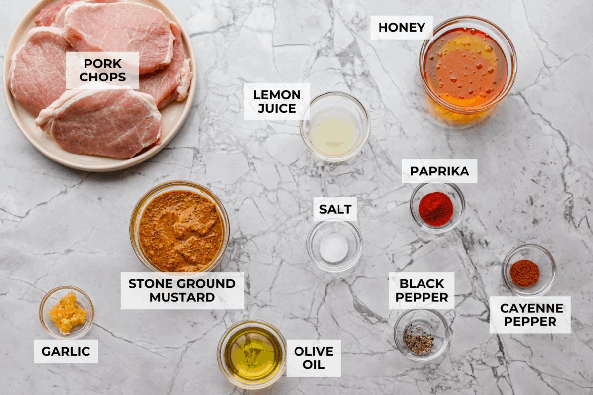 Overhead shot of labeled honey mustard pork chops ingredients.