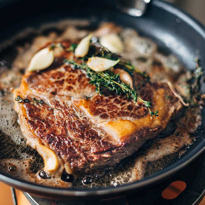 Pan-seared ribeye steak with herb butter - steakhouse date night dinner at home