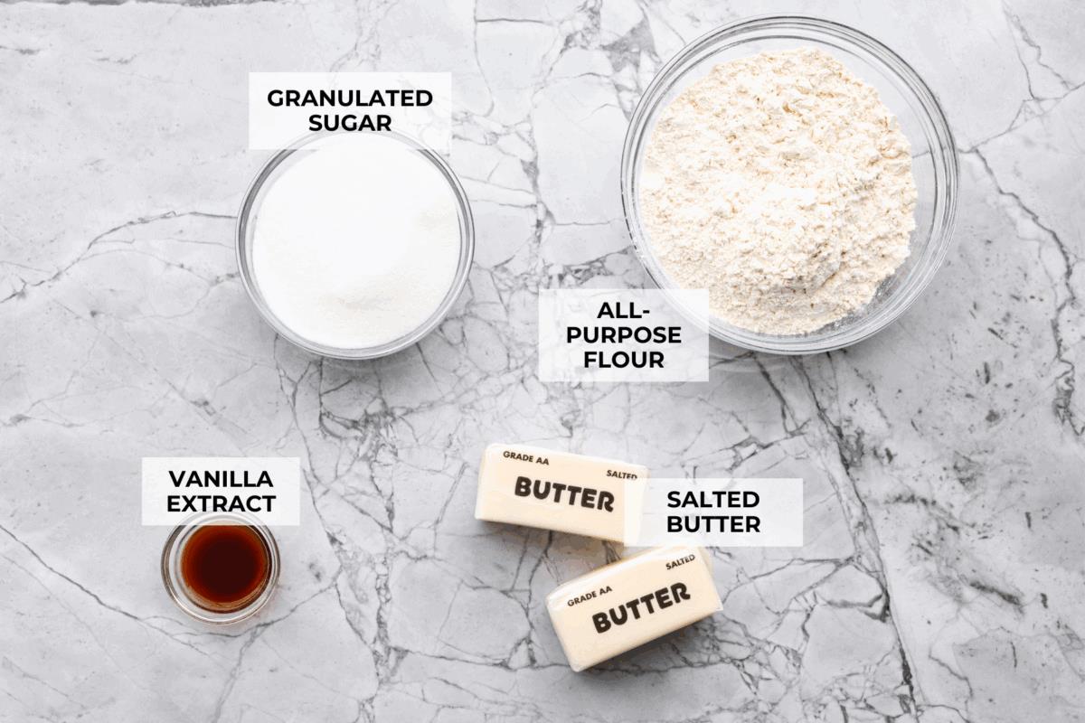 Overhead shot of labeled 4 ingredient sugar cookie ingredients.