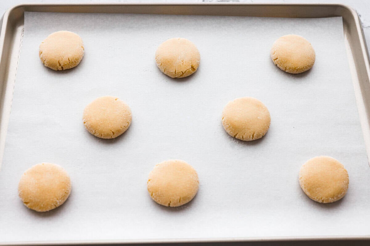 Cookie dough balls smashed slightly.