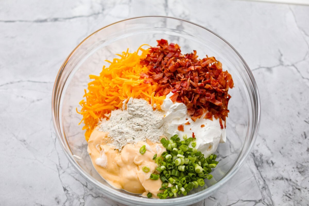 All of the sauce ingredients added to a bowl.