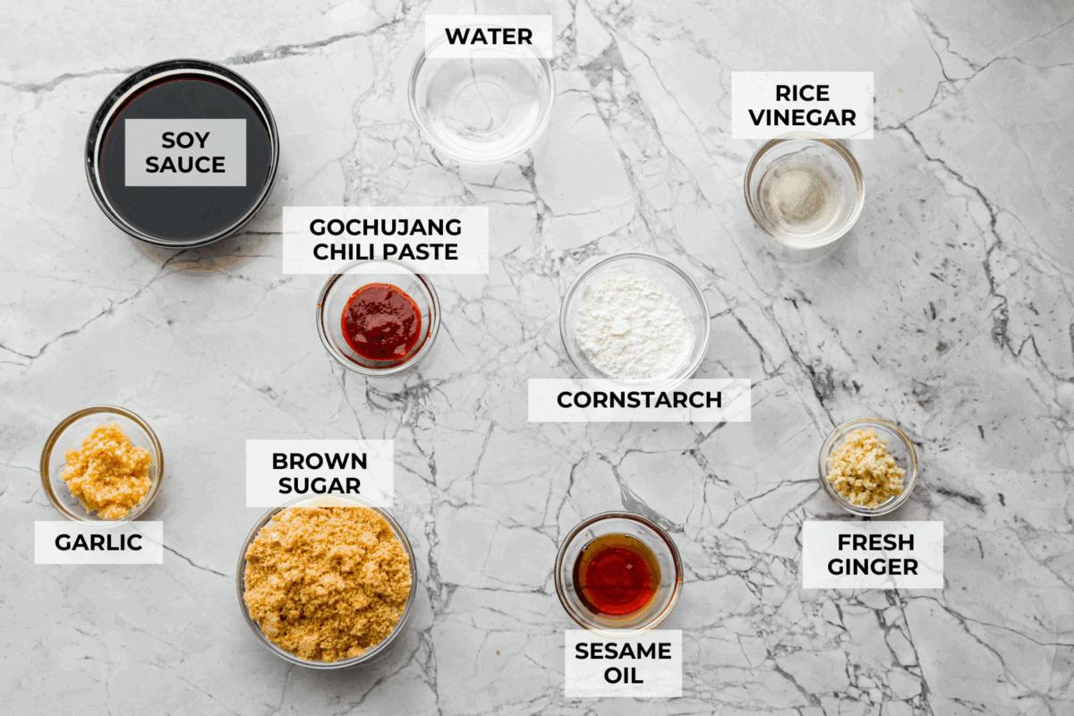 Overhead shot of labeled Korean BBQ sauce ingredients.