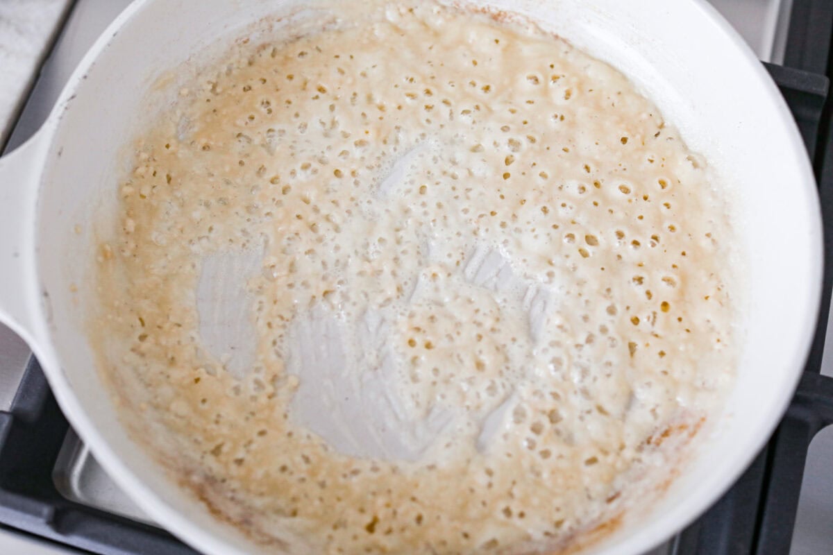 Butter, garlic, and flour added to a skillet.