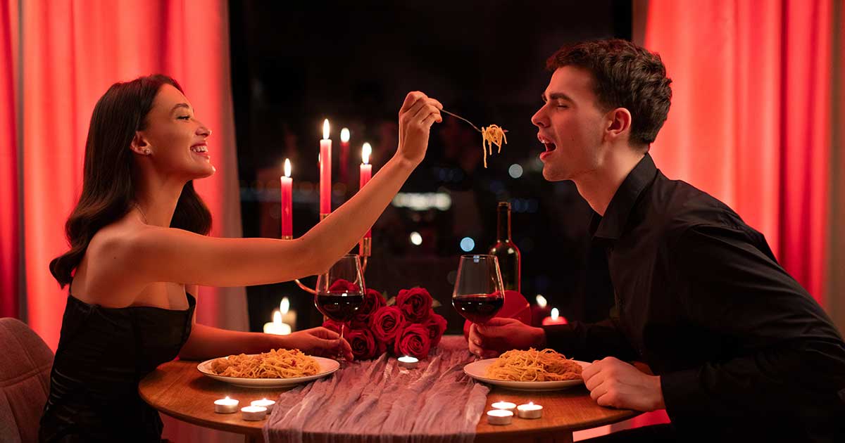 Married couple having intentional conversation before anniversary dinner, setting aside phones and connecting meaningfully